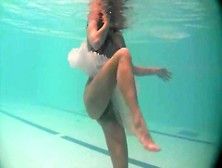 Sheer White Dress On A Teen Swimming In The Pool