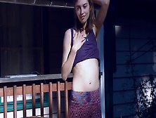 Cute Hippie Dancing In Skirt On Wooden Porch