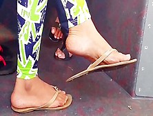 Feet In Sandals On Bus