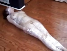 Plasticwrapped Mummified Girl