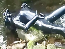 Outdoor Walk In The Wood And River Bath Full Encased In Ebony Latex Catsuit And Rubber Gas Mask