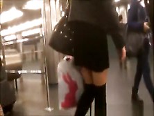 Woman In Short Black Skirt And Black Socks Upskirted