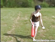 Cute Teen Kitty Playing Baseball Outdoors
