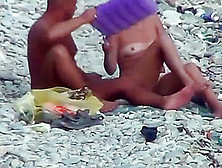 Couple Having Sex At The Beach