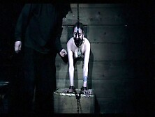 Slave Tied In Pillory Wall Endures Torment Pt. 1