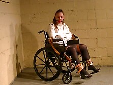 Straitjacketed Girl Strapped Into Wheelchair
