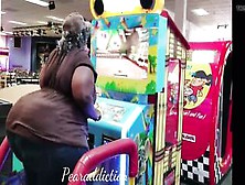 Huge African Butt At The Arcade