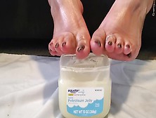 A Big Breasted Woman Goddess Dips Her Feet In Vaseline