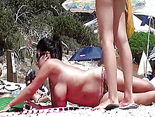Two South European Babes Topless On The Beach