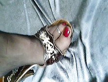 Slutty Mature Woman Showing Her Sexy Feet And Toe Rings In High Heel Shoes