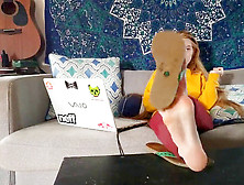 College Girl Sits On Sofa,  Liquidates Flip-Flops & Shows Soles.