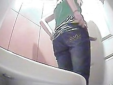 Taking Off Her Pants And Preparing To Take A Piss On Hidden Cam
