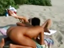 Young Lesbians On The Beach Watched By Voyeurs