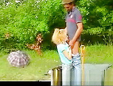 Older Guy With His Blonde Girl Outdoors