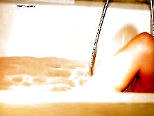 Dark Haired Babe Iwia Liking A Tub-Hot Tub Where She Luxuriates Into The Feel Of Her Hands All Over Her Silky Soft