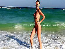 Divine Blonde With Large Breasts Naked At The Beach