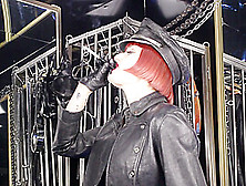 Mistress Tokyo Smoking Cigarette In Leather,  Gloves And Muir Cap