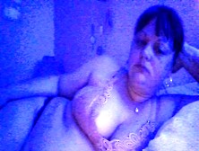 Busty Brunette Milf Indulges In Nighttime Smoking Seduction