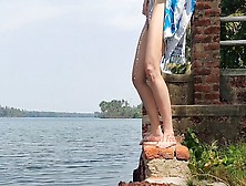 Shameless Tourist Lady Pissing On The Public Waterfront Taking Off Her Swimsuit.