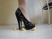 She Wears Nylon Tights,  High Heels And Crushes A Banana With Her High Heels.
