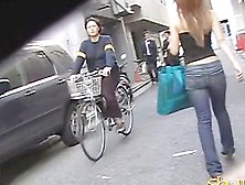 Slim Asian Girl Engaged Into Boob Sharking On The Street.