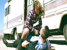 A Dude Is On The Side Of The Road,  With A Hot Blonde In A Trailer