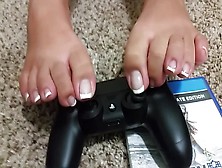 Sexy Girl With French Peticure Plays The Playstation With Nothing But Her Little Feet