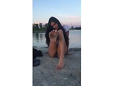 Amateur Nerd Displaying Her Sexy Chocolate Feet And Toes By The Water