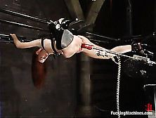 Redhead Babe In Chains Gets Rammed By Fucking Machines