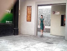 Chinese Girl Using A Public Bathroom