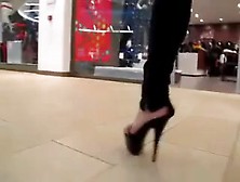 Teen Heel Flashing In Mall