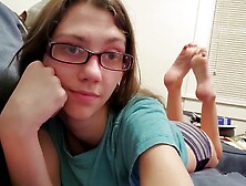 Teen Babe With Eyeglasses Showing Off Her Feet And Wiggling Her Toes In A Solo