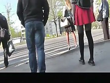 Girl In Red Short Skirt And Black Leggings Upskirted