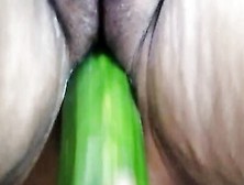 Amateur Woman With A Freshly Shaved Pussy Is Using A Cucumber For Masturbation