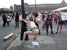 Female Agitator Pees And Poops On A Poster At A Rally In Protest To The Government