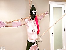Latex Sub Stress Tied On Tiptoes In Predicament Bondage With A Crotch Rope Is Made To Cum Hard