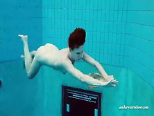 Lovely Teen Brunette Chick Swims Naked In The Pool