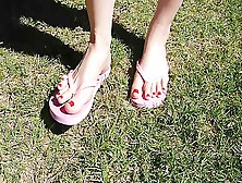 Stunning Toes With Red Nailpolish Wearing Pink Flip Flops