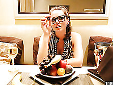 Sweet Chick With Glasses Wearing Black And White Stripe Dress Sits On A White Couch And Opens A Basket Full Of Fruits Then Eats