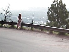 Lonely Ginger Doll Is Filmed While Using A Magic Wand Outdoors