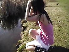 Cute Asian Teen Dances Around The Duck Filled Pond