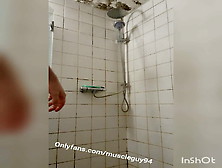 Muscular Bodybuilder Is Taking Shower Cleaning Body
