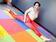 A Woman In Yoga Leotards Practices Yoga In The Gym.  Transparent Red Leotard Yoga.  Full Video - Regina Noir