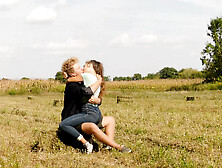 Beautiful Teen Couple In Love Passionately Kissing On The Field