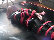 Strapped Gagged Vibed In Rubber Catsuit