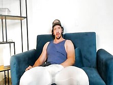 Beefed Guy In Leggings Poses On The Couch And Touches His Cock