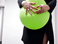 Women Popping Balloon With Pins