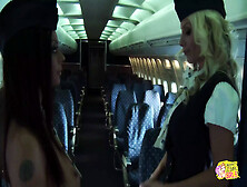 Two Naughty Flight Attendants Show Their Pussies To Each Other And Bang With A Dildo