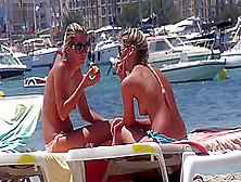 Two Hot Bodied Blonde Babes Sunbathe On Topless Beach