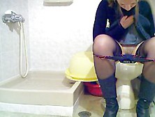 Sexy Lady With Denim Skirt In A Toilet Cam Scene